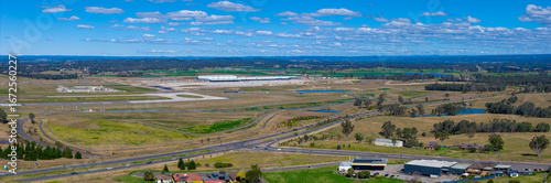 Drone aerial panoramic photograph of the new Western Sydney International Airport Logistics Precinct in the Greater Western Sydney suburb of Badgerys Creek in New South Wales, Australia. 
