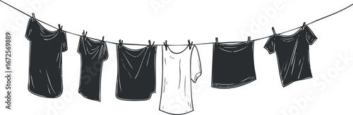 Black and white illustration of six tshirts hanging on a clothesline with clothespins for drying