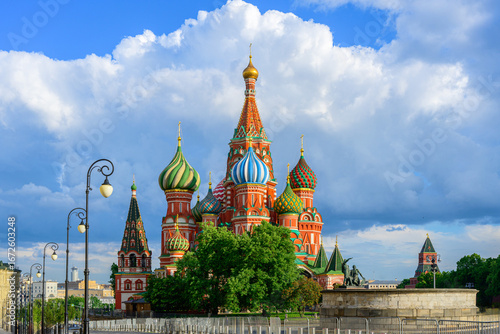 Colorful Saint Basil’s Cathedral with onion domes on Red Square in Moscow, Russia, landmark Orthodox church and famous tourist attraction against blue sky and clouds in summer