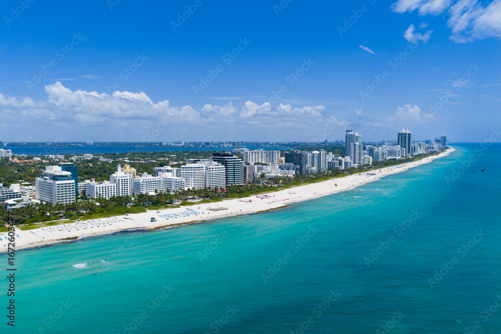 Fototapeta premium Aerial view of Miami beach coastline. Skyline and skyscrapers at Miami Beach. Summer Miamis vibes. Panoramic cityscape of Miami Beach. Miami skyline at daylight.