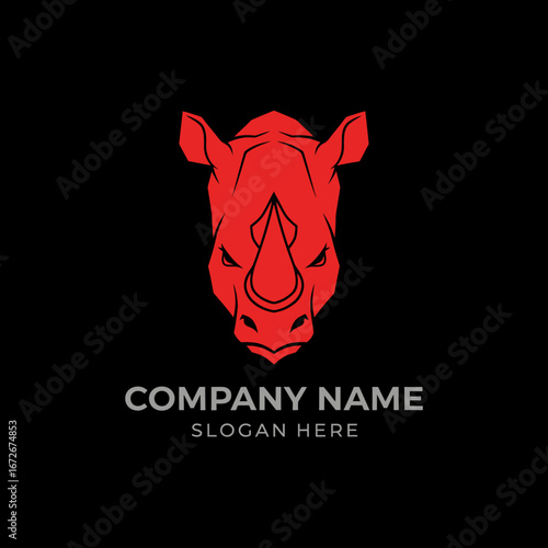 Red rhinoceros head illustration facing forward on a black background, suitable for a logo or branding.