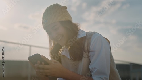 The way forward young gen z teen asia people happy relax using phone AI chat bot talk sit in public park city life text mobile app. Credit card buying social media online future modern retail growth.