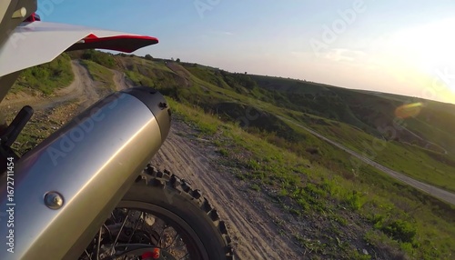 Dirt bike on a scenic trail at sunset