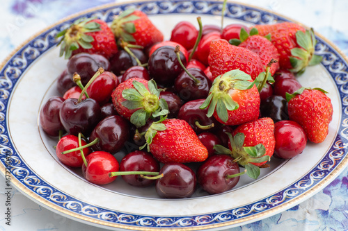 Fresh ripe red fruits and berries, cherry and strawberry, healthy food