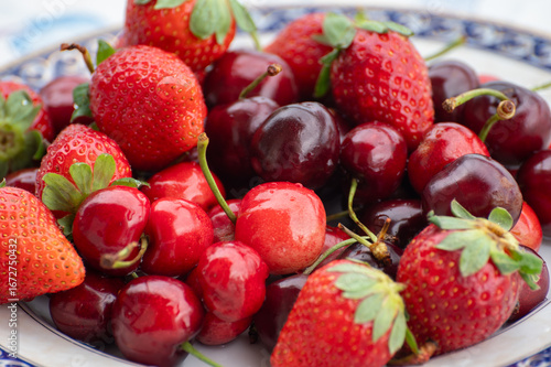 Fresh ripe red fruits and berries, cherry and strawberry, healthy food