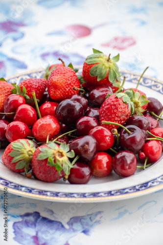 Fresh ripe red fruits and berries, cherry and strawberry, healthy food