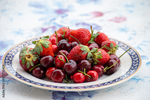 Fresh ripe red fruits and berries, cherry and strawberry, healthy food