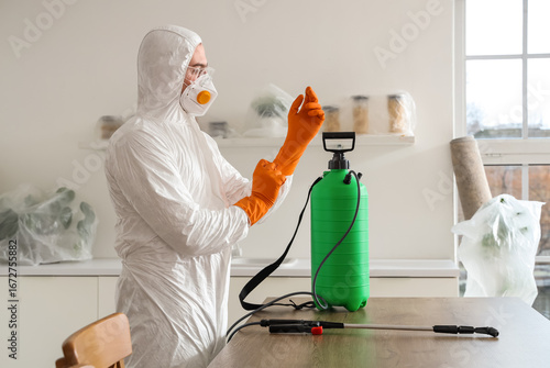 Male worker wearing hazmat ...