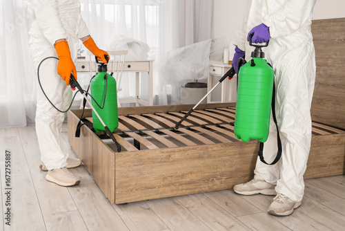 Male workers disinfecting b...