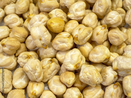 Obraz na plátne A full-frame macro shot of uncooked chickpeas filling the entire image the detai
