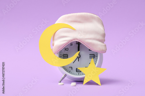 Alarm clock with sleeping m...