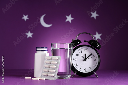 Melatonin pills with glass ...