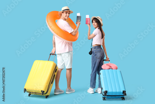 Couple of tourists with sui...