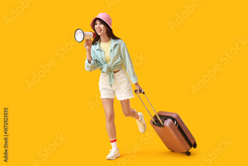 Female tourist with suitcas...