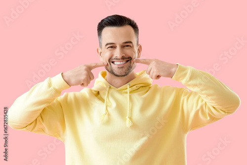 Young man with beautiful sm...
