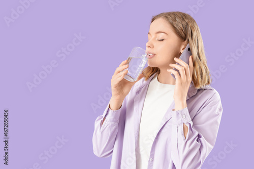 Young woman drinking fresh ...
