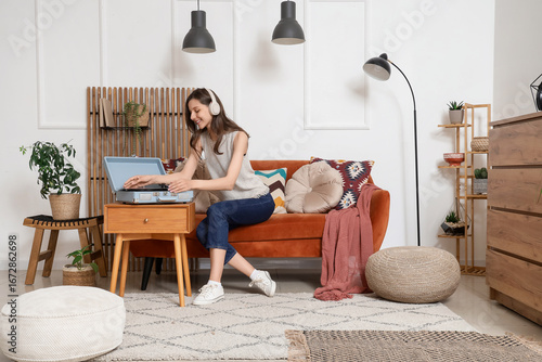 Young woman in headphones w...