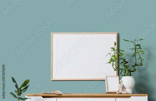 Vase with green twigs and p...