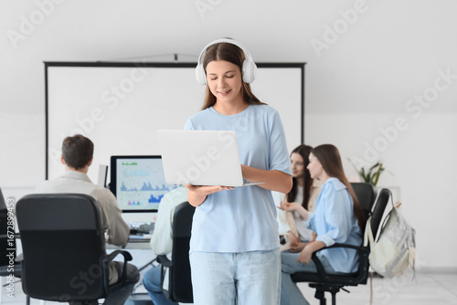 Female student in headphone...