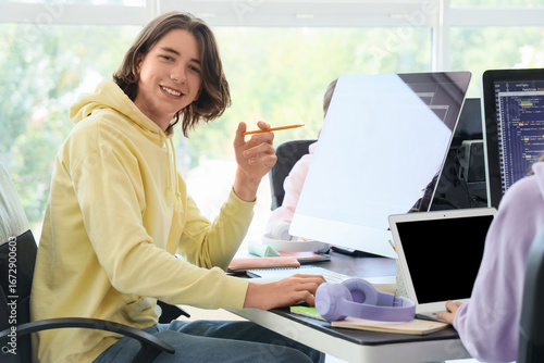 Male student studying at sc...