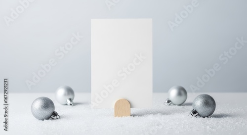 blank christmas card mockup with silver ornaments and snow