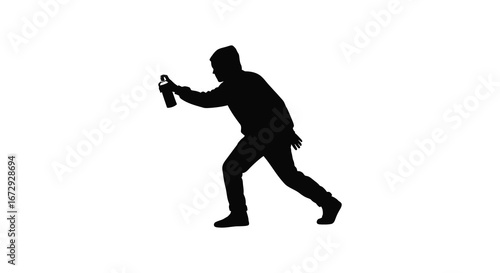 Man in silhouette running with spray can in hand