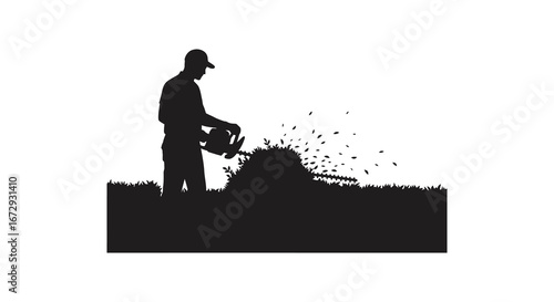 Man spreading seeds or fertilizer on a grassy field