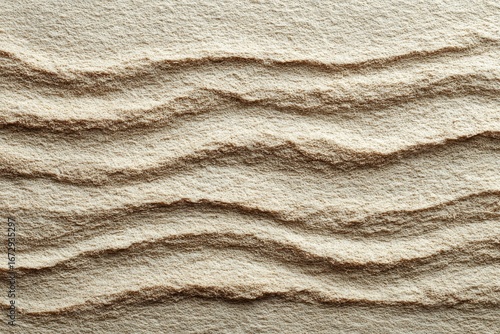 Beige powder sculpted into wavy lines