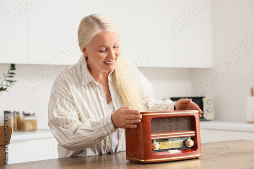 Senior woman with retro rad...