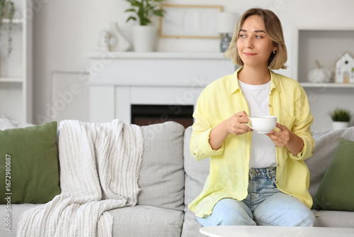 Beautiful woman with cup of...