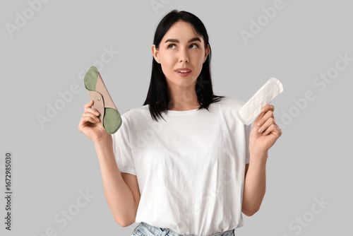 Thoughtful young woman with...