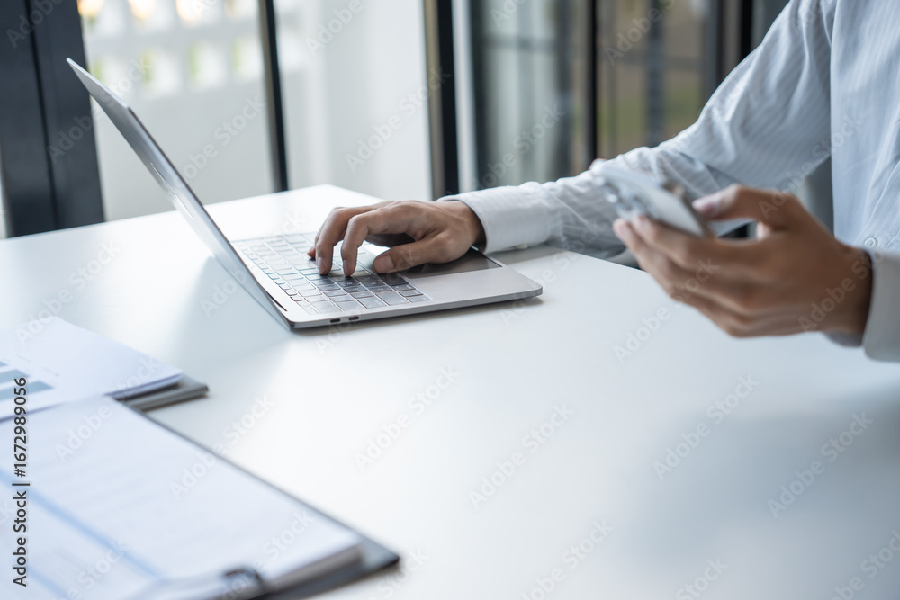 Naklejka premium Successful Businessman Using Smartphone During Office Work
