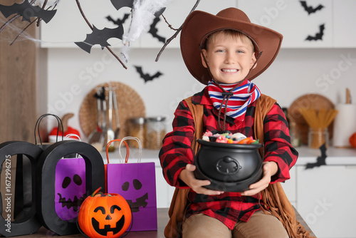 Little boy dressed as cowbo...