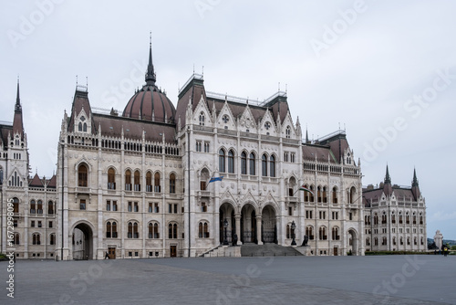 Budapest, Hungary – Architectural detail of the Hungarian Parliament Building (Országház), showcasing Neo-Gothic ornamentation, pointed arches, spires, and intricate stone carvings.