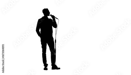 Dynamic silhouette of a performer on stage holding microphone with anticipation ready for the show, ready to inspire and entertain the audience