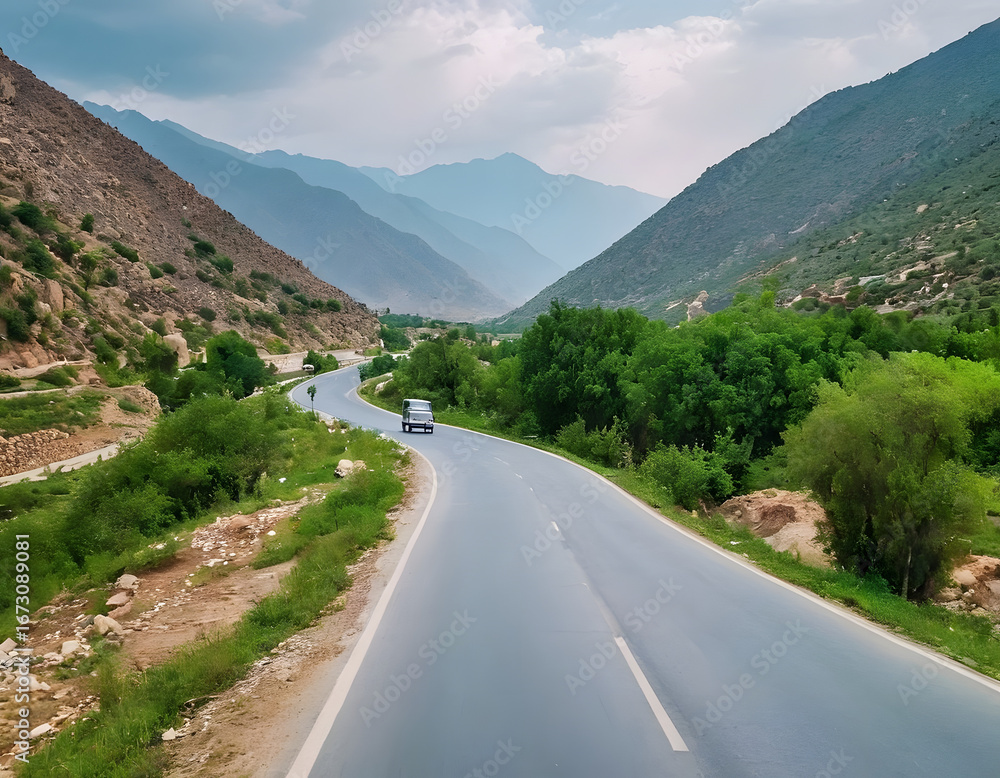 Naklejka premium Beautiful photography of a highway, with green mountains in Pakistan.