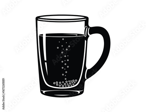 A glass mug with a dark liquid and bubbles