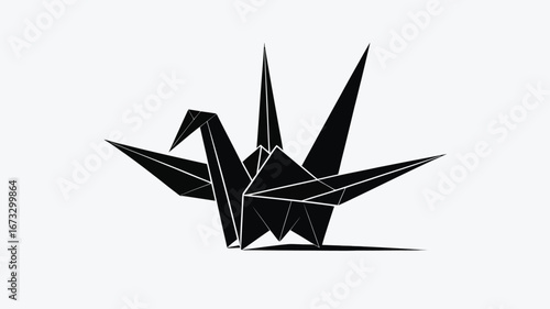 A stark black origami crane with sharp geometric lines against a plain white background surface view