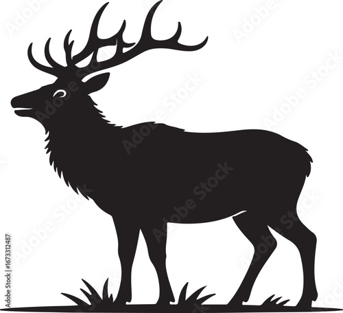 Silhouette of a majestic elk with large antlers standing in grass