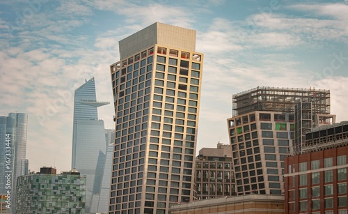Modern leaning skyscrapers in New York City with Hudson Yards in the background