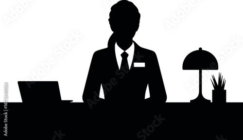 Black silhouette of a person at a desk with a laptop and lamp