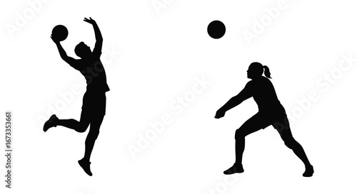 Two volleyball players in action on the court in black silhouettes
