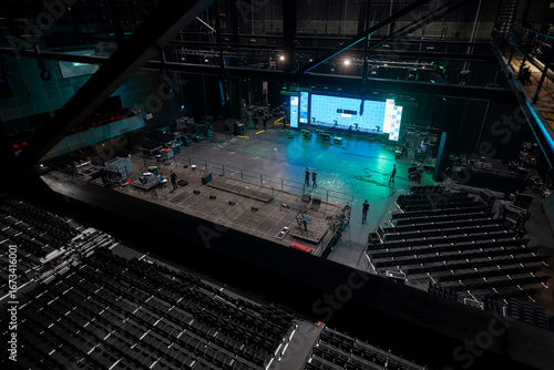 Fotografi Wide aerial shot of concert arena showing stage crew and technical equipment pre