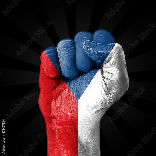 Czechia flag painted on fist showing patriotism, freedom and power, backdrop. Czech republic flag on the hand