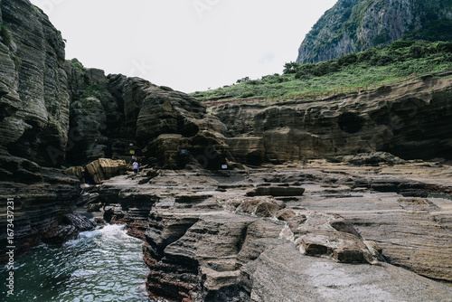 Scenery around Yongmeori Coast(Dragon head coast), a tourist attraction famous for Multistory layered rough and strange sedimentary rocks in Jeju Island, South Korea.