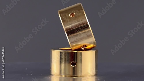 Bearing journal turbocharger, Sintered bronze bushing with internal holes.on rotating display.