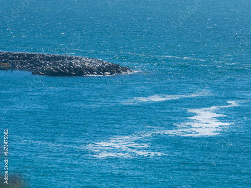 White foam produced by toxic algae near breakwater in Penneshaw, Kangaroo Island, South Australia, Australia