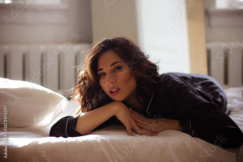 brunette girl in black silk pajamas
