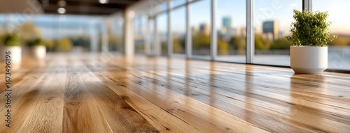 Wallpaper Mural Bright and modern interior space with wooden flooring and large windows overlooking a city skyline during sunset Torontodigital.ca
