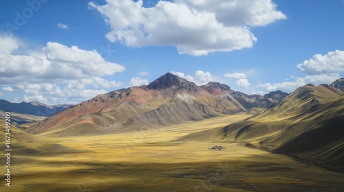Colorful Andean mountain valley landscape under a vibrant blue sky